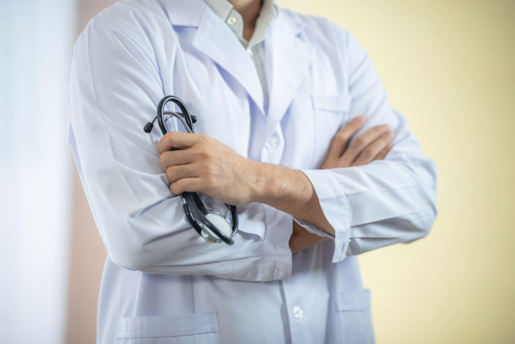 An ENT doctor holding medical tools