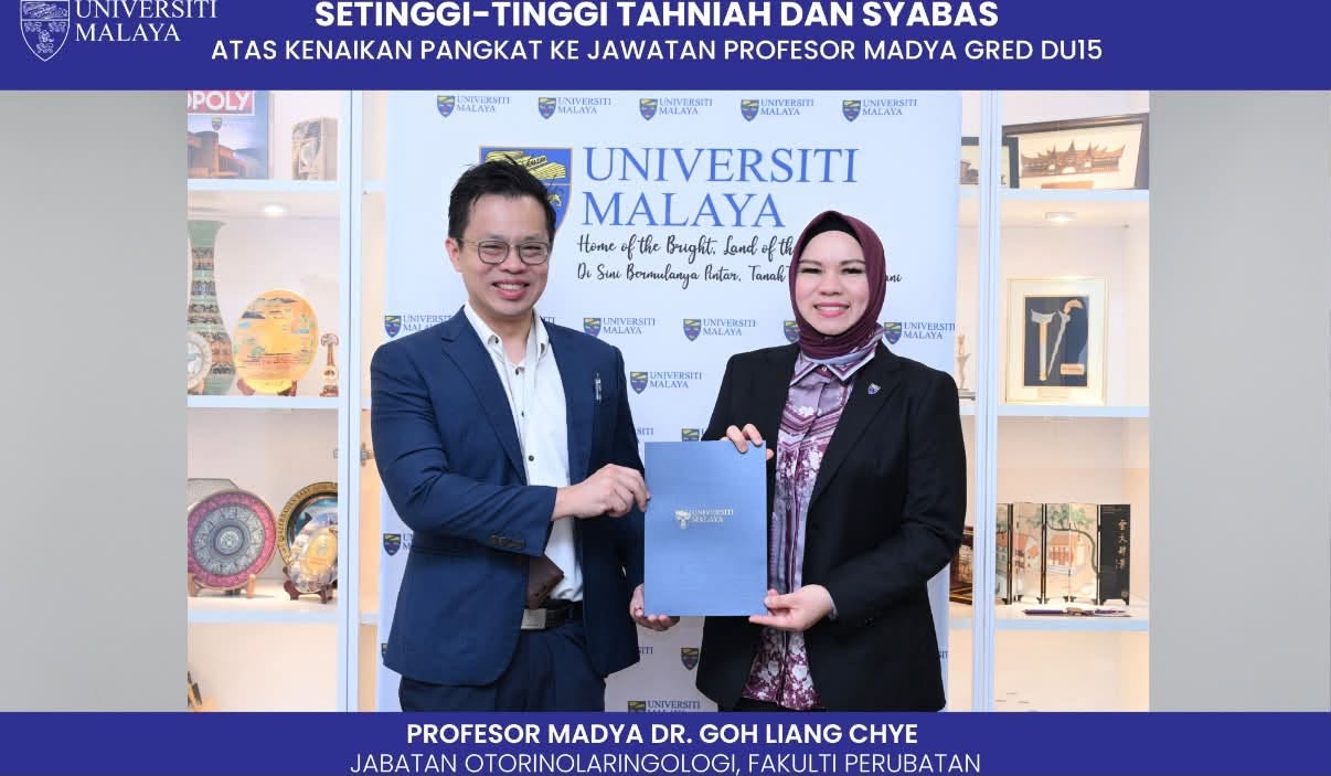 : Dr. Goh Liang Chye receiving his promotion certificate to Associate Professor from Universiti Malaya, Department of Otorhinolaryngology, Faculty of Medicine
