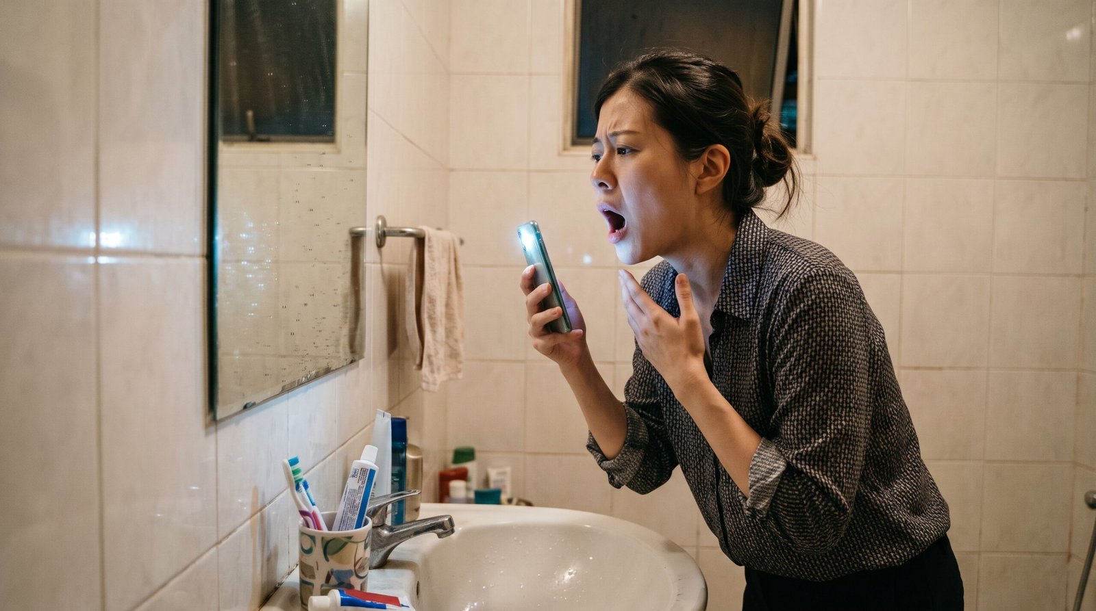 woman seeing a tonsil stone